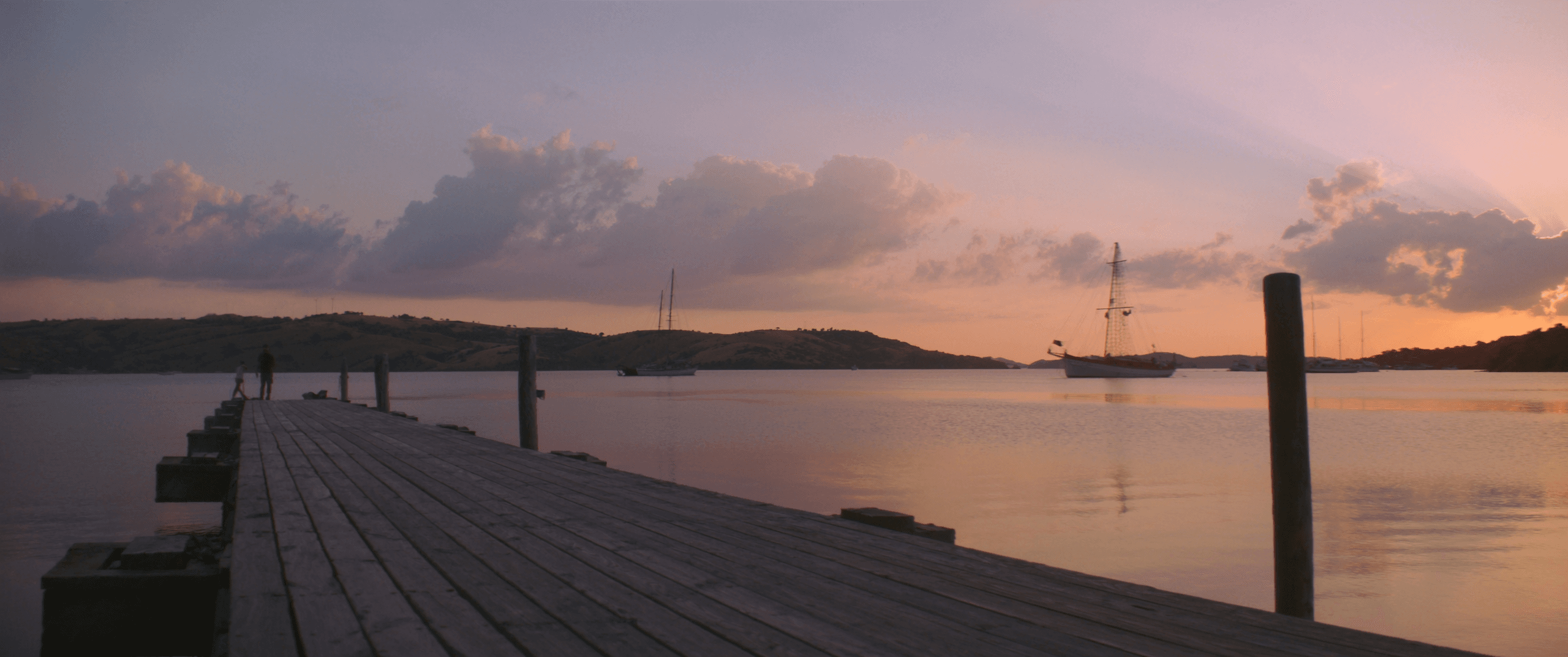 Ultra-wide view of Biscayne Bay at sunset, anchor lights coming on across the water