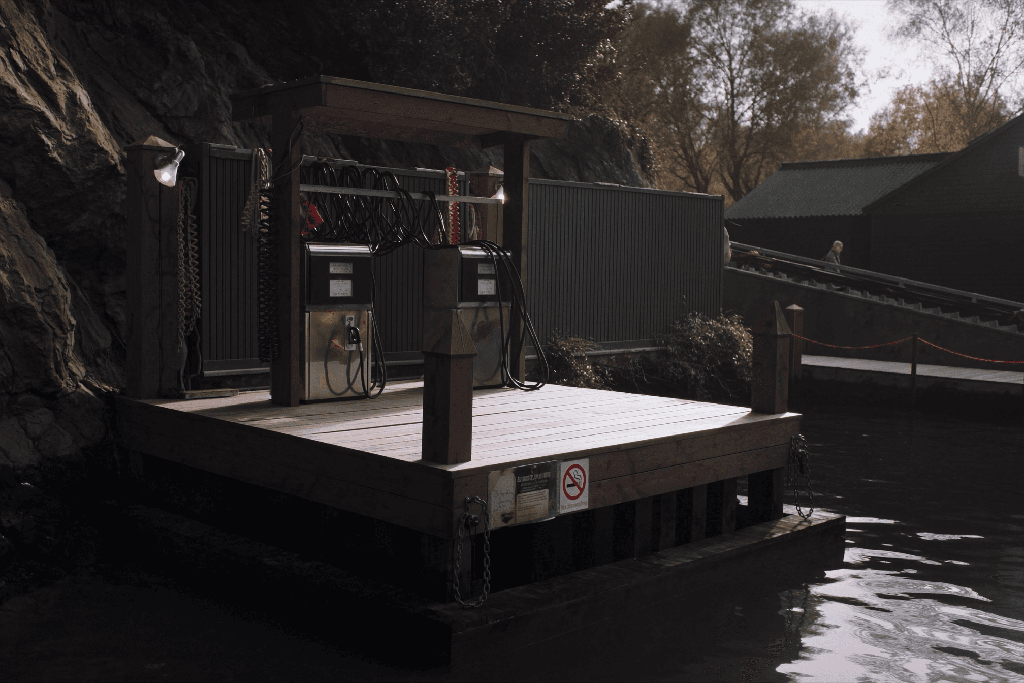 The Anchorlight fuel dock at the east end of the quay, a center console tied alongside the pumps